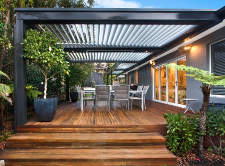 Modern deck with louvered pergola in Clintonville